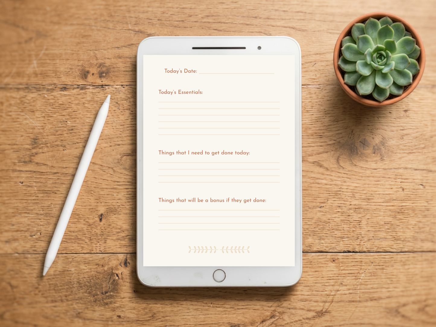A white tablet lying on a wooden tabletop, displaying a minimalist daily planner template with lined sections for date, essentials, and to-do items. A white stylus pen rests to the left, and a small potted succulent sits to the upper right.