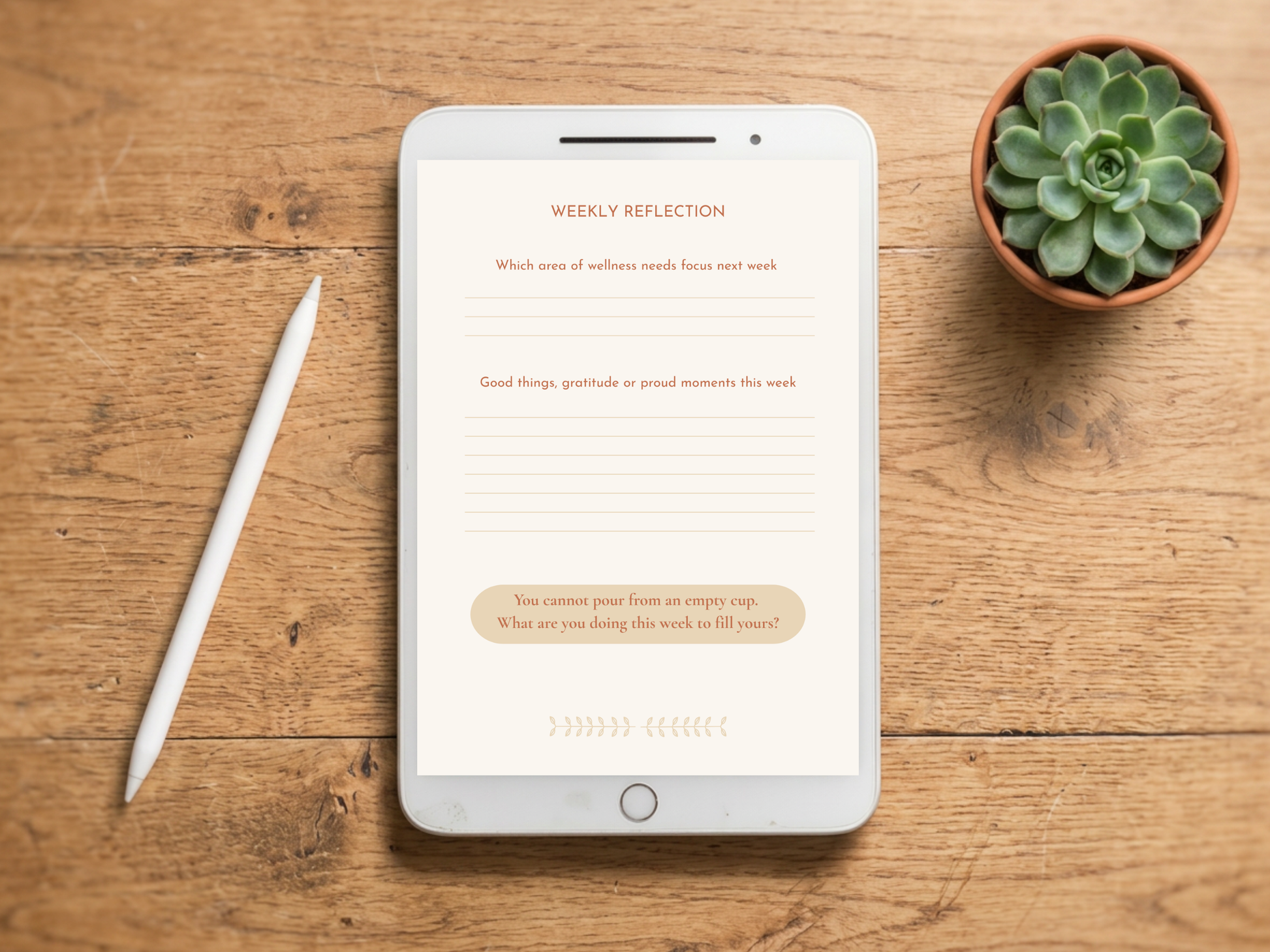 A tablet on a wooden tabletop with a white stylus beside it and a small potted succulent in the upper right. The tablet screen shows a reflection journal page titled 'WEEKLY REFLECTION' with prompt lines and a beige rounded text box.